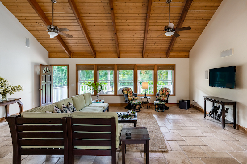 The spacious living room includes very high vaulted ceilings. 