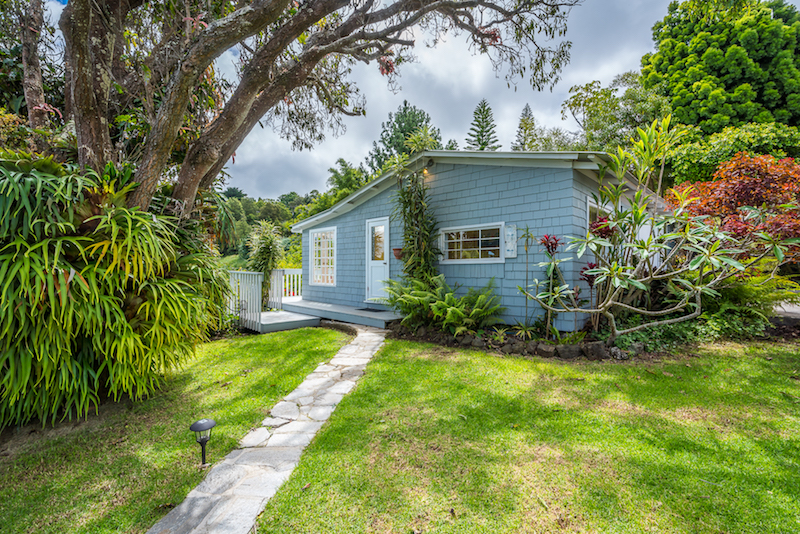 The detached garage of this classic Hawaii Plantation Style Home includes a small office with a half bath 