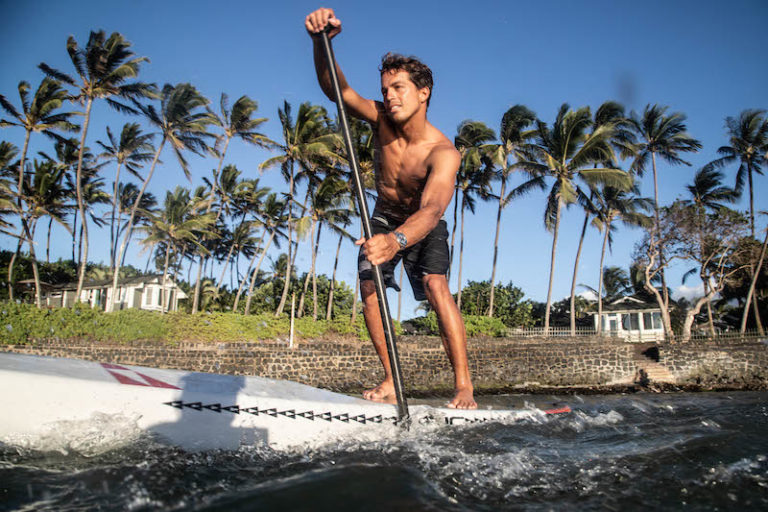Kai Lenny paddling his SUP in front of Pa'ani Point in Spreckelsville