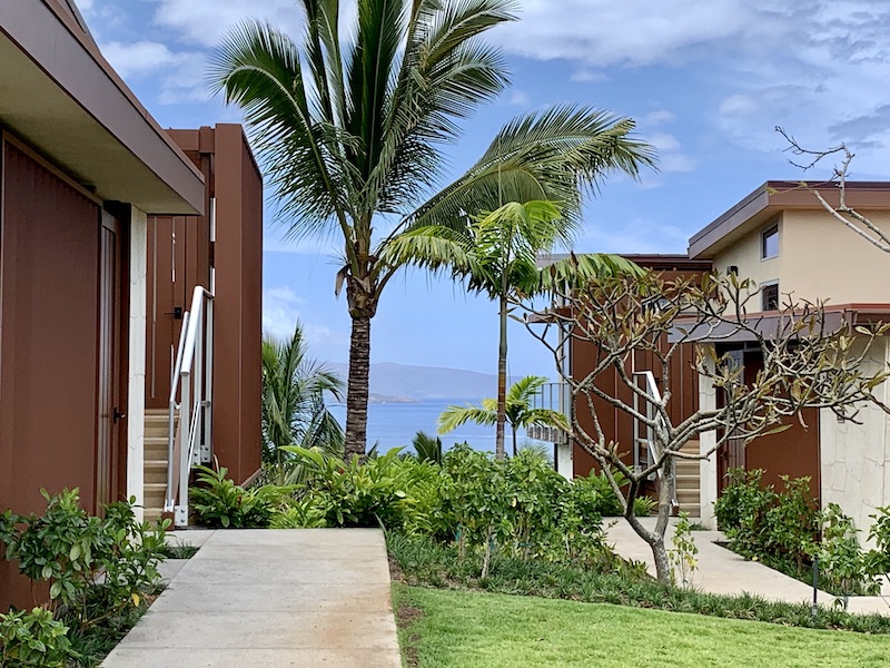 Glimpses of Kaho'olawe and Molokini between two buildings give hints of the compelling ocean and neighbor island views from a number of the Makalii Condos. 