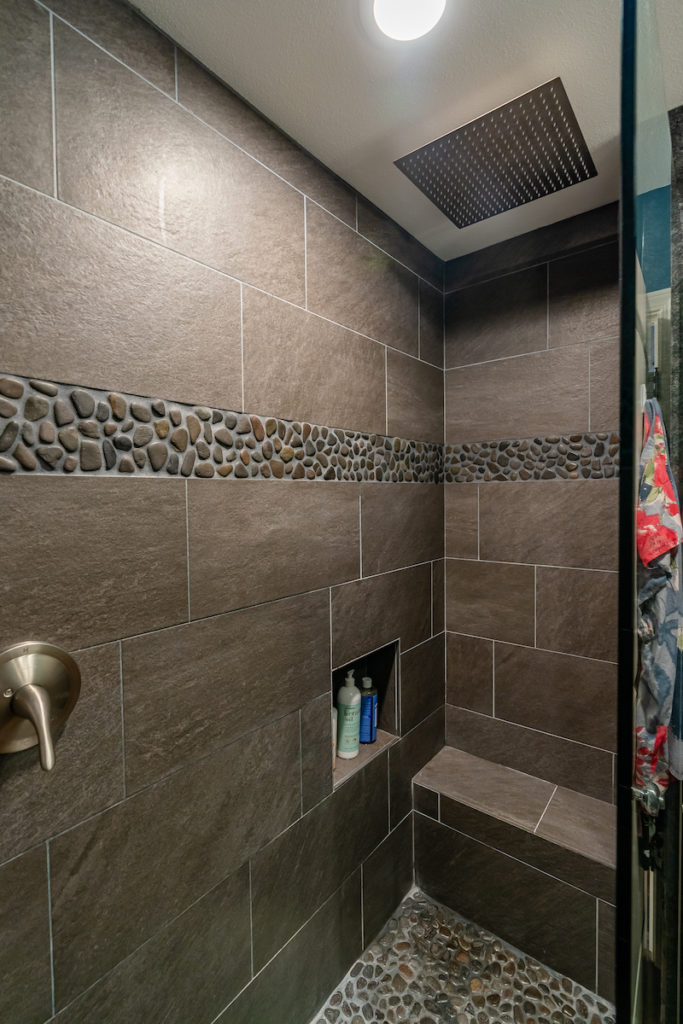 upgraded master bathroom shower of this milo-court townhome